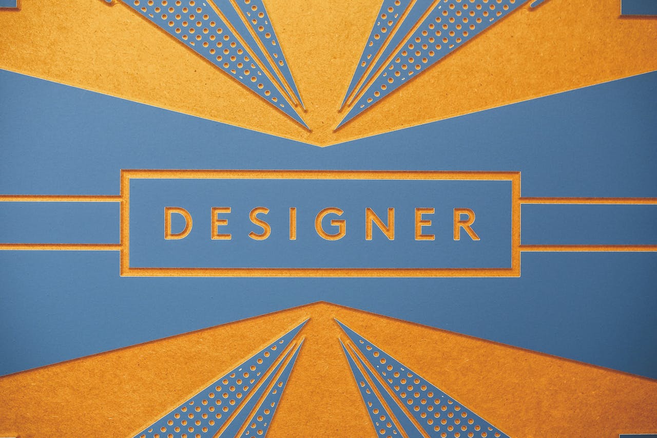 Geometric art print with a blue and orange 'DESIGNER' theme for artistic inspiration.